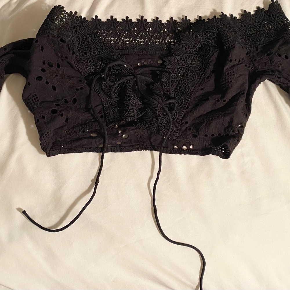 Long sleeved black lace up crop top. Size small